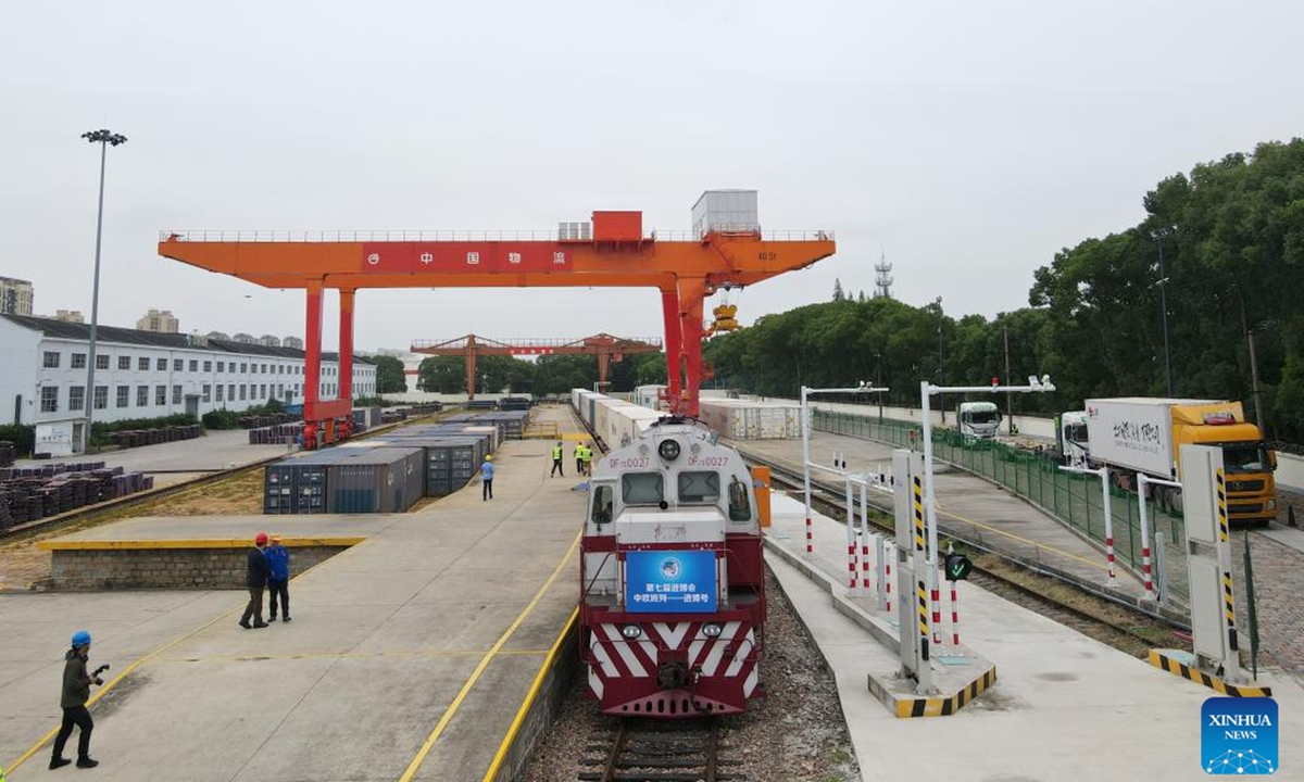 An aerial drone photo shows this year's first Jinbo China-Europe freight train pulling in the Minhang Station in Shanghai, east China, Oct. 20, 2024.The first Jinbo China-Europe freight train carrying exhibits for the 7th China International Import Expo (CIIE) arrived at the Minhang Station in Shanghai on Sunday, marking the fourth consecutive year that CIIE exhibition products have been transported to Shanghai via the China-Europe freight train service. (Photo: Xinhua)